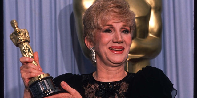Actress Olympia Dukakis holds her Best Actress in a Supporting Role Oscar for 'Moonstruck' at the Academy Awards April 11, 1988, in Los Angeles, CA.