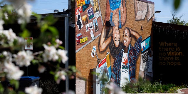 This photo shows a mural painted on the outside wall of Gibbs-Morrison Cultural Center in the 5th Ward of Evanston, Ill., Thursday, April 29, 2021.