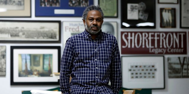 Evanston's local historian Morris "Dino" Robinson Jr., who co-authored a city-commissioned study on housing practices, poses for a portrait in Shorefront Legacy Center in Evanston, Ill., Friday, April 9, 2021.