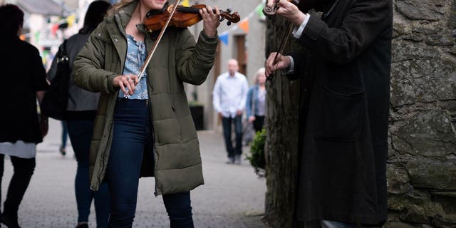 Rose Reid and Patrick Bergin play traditional Irish music in 'Finding You.'