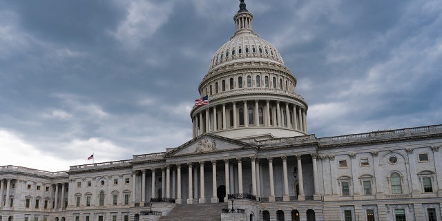 The Capitol is seen under cloud cover in Washington, Tuesday, May 11, 2021