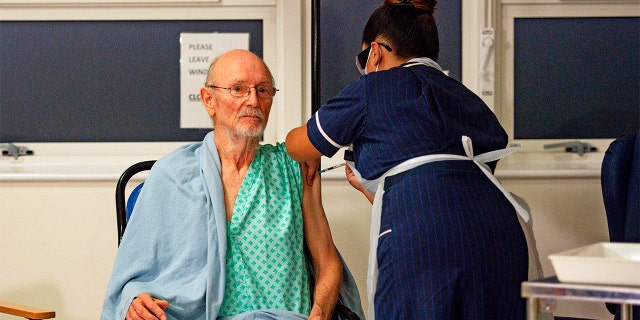 William 'Bill' Shakespeare death receives the Pfizer/BioNTech covid-19 vaccine at University Hospital, Coventry. The former parish councilor who hit the headlines around the world as the first man to receive the Pfizer-BioNTech vaccine has died of an unrelated illness. (Press Association via AP Images)