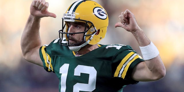 Aaron Rodgers #12 of the Green Bay Packers reacts after throwing the game winning touchdown against the Dallas Cowboys in the fourth quarter at AT&T Stadium on October 8, 2017 in Arlington, Texas.