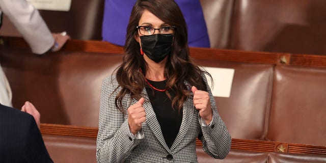 Rep. Lauren Boebert, R-Colo., makes two fists as she arrives before President Joe Biden speaks to a joint session of Congress, Wednesday, April 28, 2021, in the House Chamber at the U.S. Capitol in Washington. (Jonathan Ernst/Pool via AP)