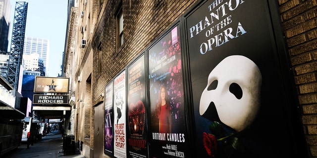 FILE - Broadway posters hang outside the Richard Rodgers Theatre during Covid-19 lockdown in New York on May 13, 2020. 