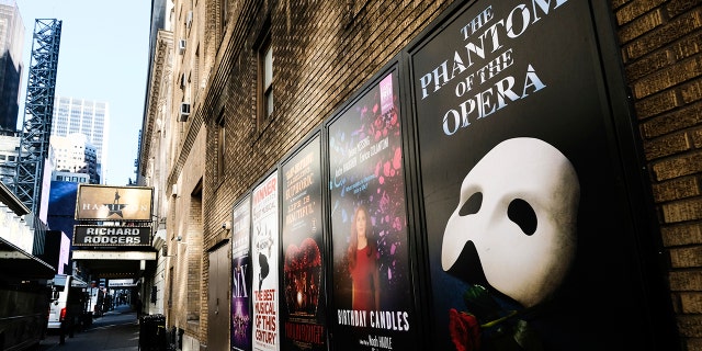 FILE - Broadway posters hang outside the Richard Rodgers Theatre during Covid-19 lockdown in New York on May 13, 2020. 