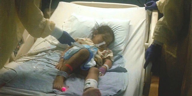 This October 2013 photo provided by the family shows Josselyn Kish on the day she received a gene therapy treatment at UCLA Mattel Children’s Hospital in Los Angeles.