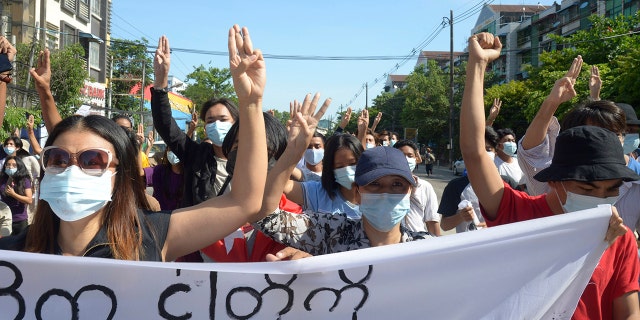 Anti-coup protesters flash the three-finger salute during a demonstration in Yangon, Burma, Friday, May 14, 2021. (AP Photo)