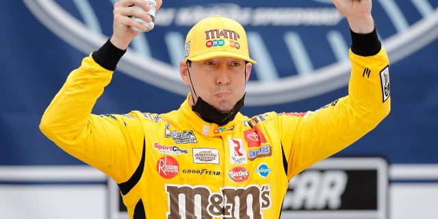 Kyle Busch celebrated in Victory Lane after winning a NASCAR Cup Series auto race at Kansas Speedway.