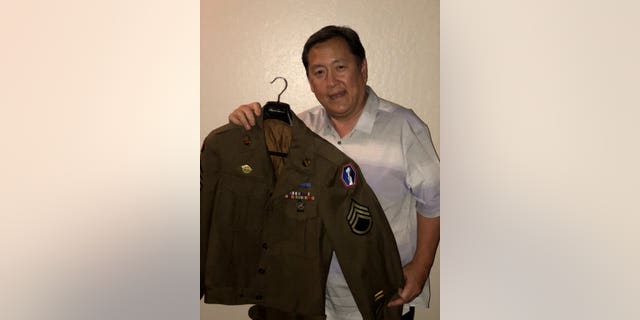 Paul Osaki with the jacket. 