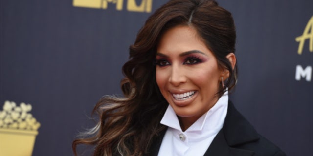 FILE - In this file photo from Saturday, June 16, 2018, Farrah Abraham arrives at the MTV Movie and TV Awards at Barker Hangar in Santa Monica, California.  Reality TV star Abraham has pleaded guilty to a misdemeanor brawl with security at the Beverly Hills Hotel.  Abraham pleaded guilty in Los Angeles court on Friday, November 2, 2018, to one charge of resisting police.  (Photo by Jordan Strauss / Invision / AP, on file)