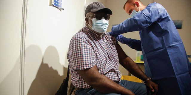 May 6, 2021: A man receives a Pfizer COVID-19 vaccine at a new vaccination center run by the Paris' fire brigade in Paris.