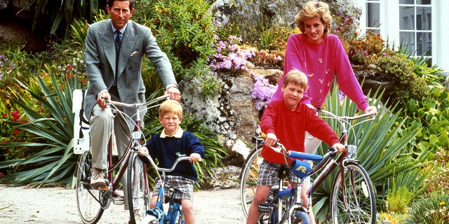 The Prince and Princess of Wales with sons Prince William, right, and Prince Harry prepare for a cycling trip in Tresco during their holiday in the Scilly Isles. (Photo by PA Images via Getty Images)