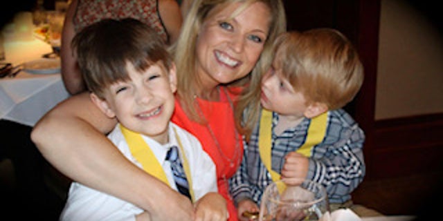 A younger Jerron Hoffman, at left, with his mom and brother.