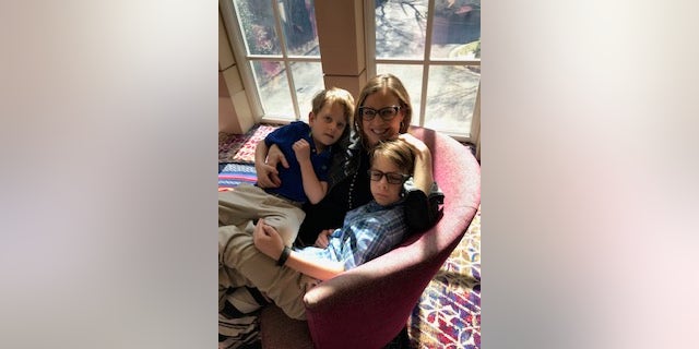 Jerron Hoffman (at right, above) is helping kids with cancer in honor of his mom, Kim, who passed away in 2021 after battling neuroendocrine cancer. "There's a bunch of things you can do," said Jerron Hoffman about helping other people who are struggling.