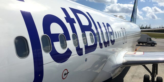 This file photo shows JetBlue land operations and boarding in Owen Roberts Intl. Airport in Grand Cayman Island.