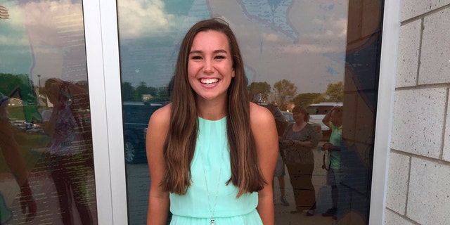 In this September 2016 photo provided by Kim Calderwood, Mollie Tibbetts poses for a picture during homecoming festivities at BGM High School in her hometown of Brooklyn, Iowa. (Kim Calderwood via AP)