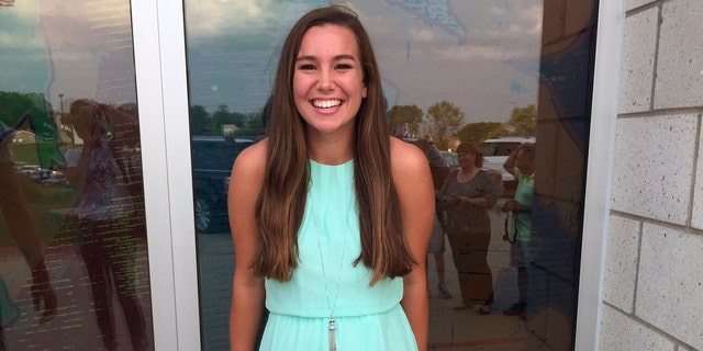 In this September 2016 photo provided by Kim Calderwood, Mollie Tibbetts poses for a picture during homecoming festivities at BGM High School in her hometown of Brooklyn, Iowa. (Kim Calderwood via AP)