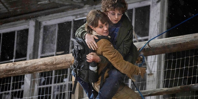This image released by Warner Bros. Entertainment shows Angelina Jolie and Finn Little in a scene from 'Those Who Wish Me Dead.'