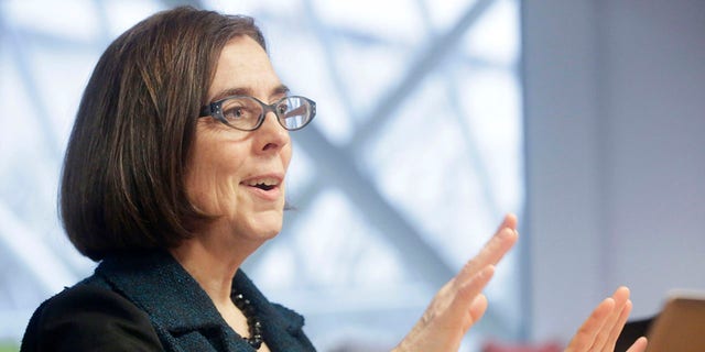 Kate Brown, governor of Oregon, speaks during an interview in Portland, Oregon, U.S. on Wednesday, Jan. 20, 2016. Brown, a Democrat, joined the state House of Representatives in 1991, was later elected to the Senate and served as secretary of state since 2009, before taking over as governor in February. Photographer: Meg Roussos/Bloomberg via Getty Images