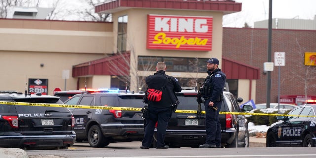 Police work the scene outside of a King Soopers grocery store on March 22 where a shooting took place in Boulder, Colo. (AP)