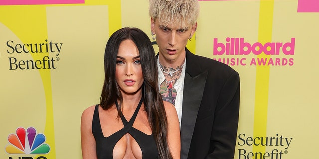 Megan Fox's engagement ring is actually designed to hurt her if she takes it off. The ring's bands are thorns, Machine Gun Kelly explained in a new interview.