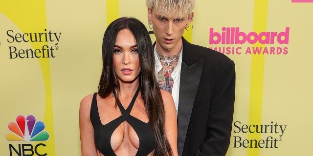 Megan Fox's engagement ring is actually designed to hurt her if she takes it off. The ring's bands are thorns, Machine Gun Kelly explained in a new interview.