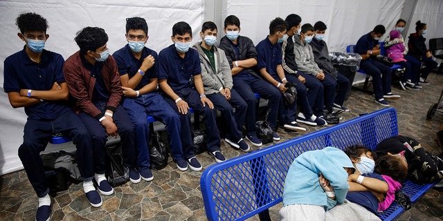 In this March 30, 2021, file photo, young unaccompanied migrants wait for their turn at the secondary processing station inside the U.S. Customs and Border Protection facility. The number of unaccompanied children encountered on the U.S. border with Mexico has increased since President Biden took office in January 2021, according to CBP figures. 
