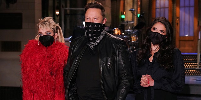 Pictured: (l-r) Musical guest Miley Cyrus, host Elon Musk, and Cecily Strong during Promos in Studio 8H on Thursday, May 6.