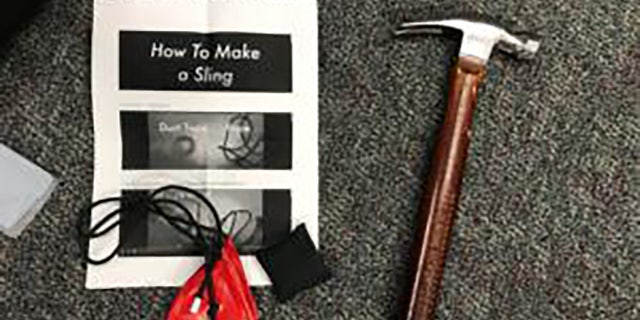 Items seized from protesters included a hammer and instructions on how to slingshot.  (Portland Police Department)