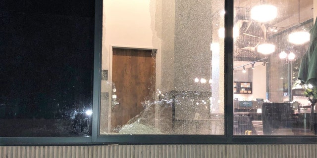 Rioters smashed a Starbucks window in downtown Portland during a night of vandalism earlier this month. 