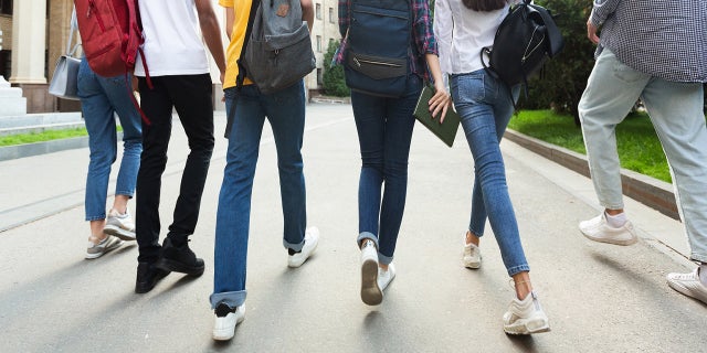 Friends walk into school together. "Father, I pray that each child knows their strength comes from You."