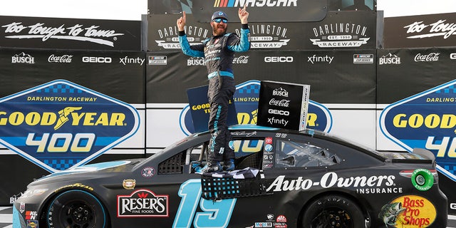 Martin Truex Jr. celebrates winning the NASCAR Cup Series Race at Darlington