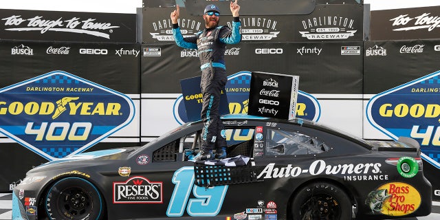 Martin Truex Jr. celebrates winning the NASCAR Cup Series Race at Darlington