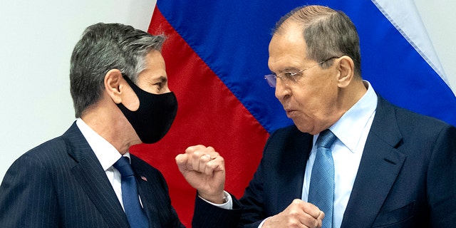 U.S. Secretary of State Antony Blinken, left, greets Russian Foreign Minister Sergey Lavrov, right, as they arrive for a meeting at the Harpa Concert Hall in Reykjavik, Iceland, Wednesday, May 19, 2021, on the sidelines of the Arctic Council Ministerial summit. (Associated Press)