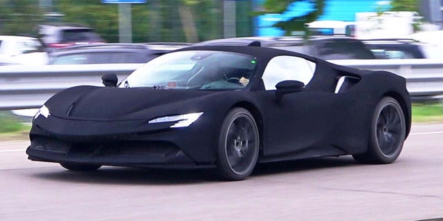 This Ferrari SF90 Stradale appears to be coated in Vantablack