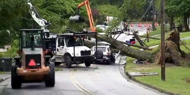 Storm damage in a neighborhood in Douglasville during tornado warnings in metro Atlanta. One fatality was reported when a tree fell on a car.