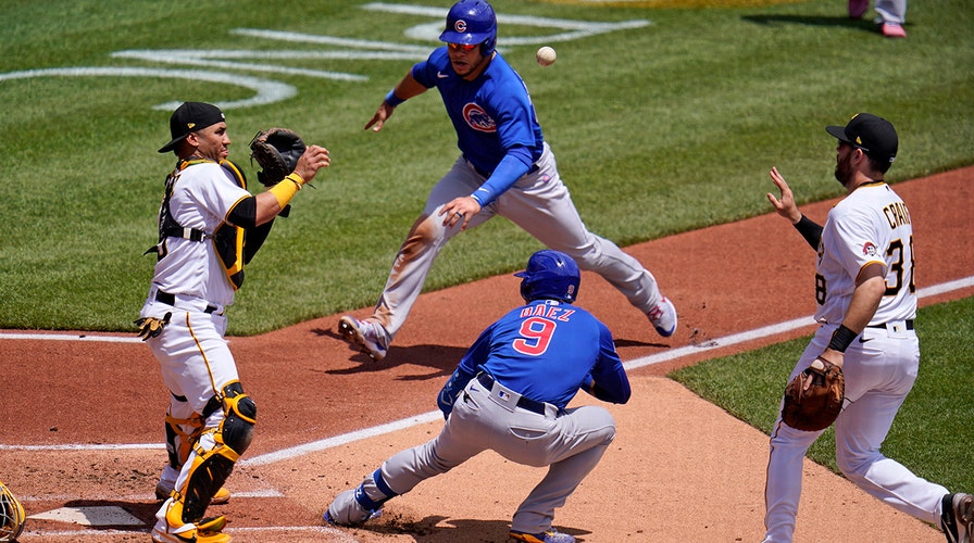 Cubs SS Javy Baez tosses bat past mound on strikeout, sails throw over  first base into stands