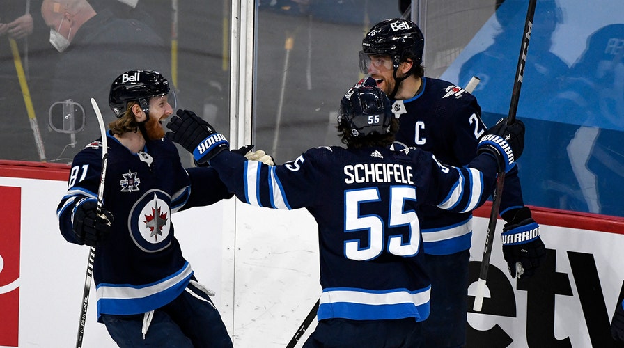 Wheeler helps Jets beat Canucks, clinch 3rd place in North
