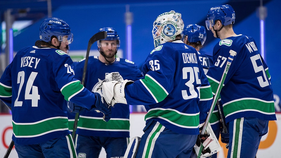 Demko makes 38 saves and Canucks top Flames 4-2