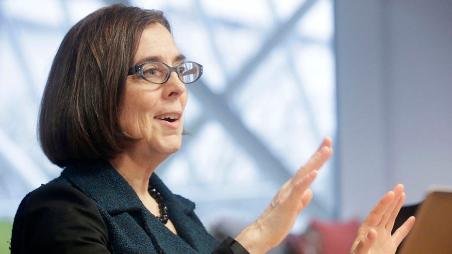 Oregon Democratic Gov. Kate Brown agrees to halt clemency for felons until lawsuit plays out, lawyer says