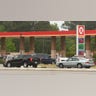 Lines form at the Circle K station in Belville, North Carolina, early Tuesday, May 11, 2021, after the country s largest pipeline supplying nearly half of the fuel to states from Texas to the East Coast shut down its operations. Gov. Roy Cooper on Monday signed an executive order declaring a state of emergency in North Carolina that helps waive specific size and weight requirements for gas trucks.