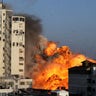 Smoke and flames rise from a tower building as it is destroyed by Israeli air strikes amid a flare-up of Israeli-Palestinian violence, in Gaza City May 12, 2021.