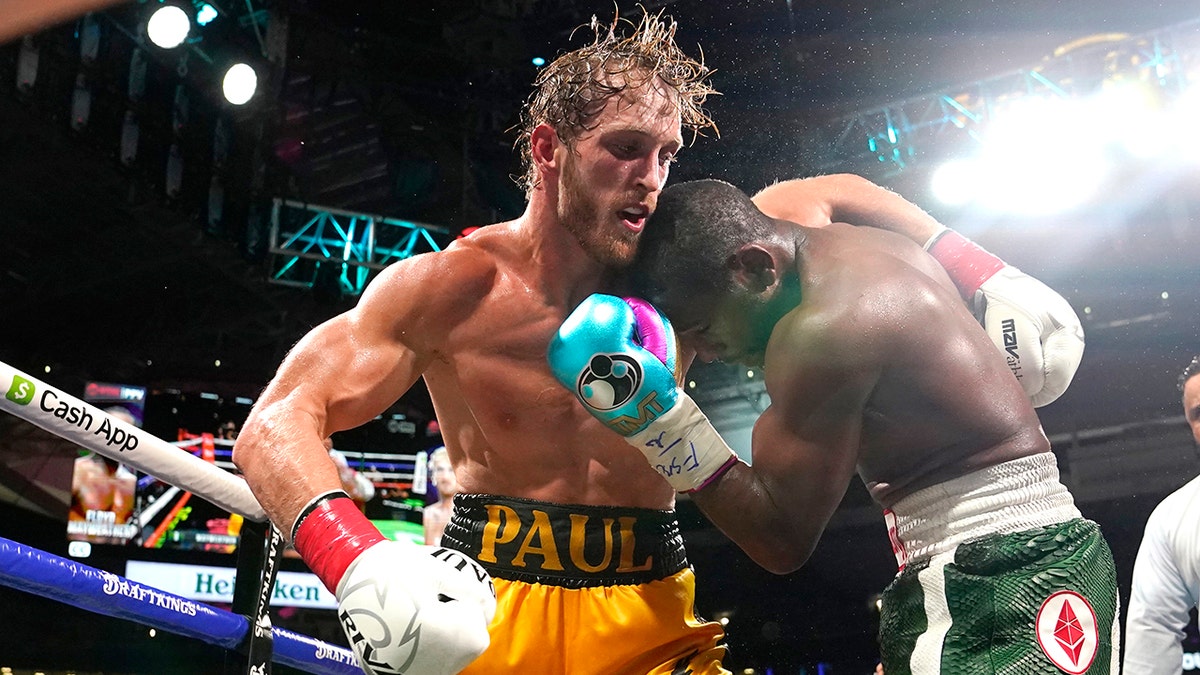 Logan Paul, left and Floyd Mayweather fight during an exhibition boxing match at Hard Rock Stadium, Sunday, June 6, 2021, in Miami Gardens, Fla.