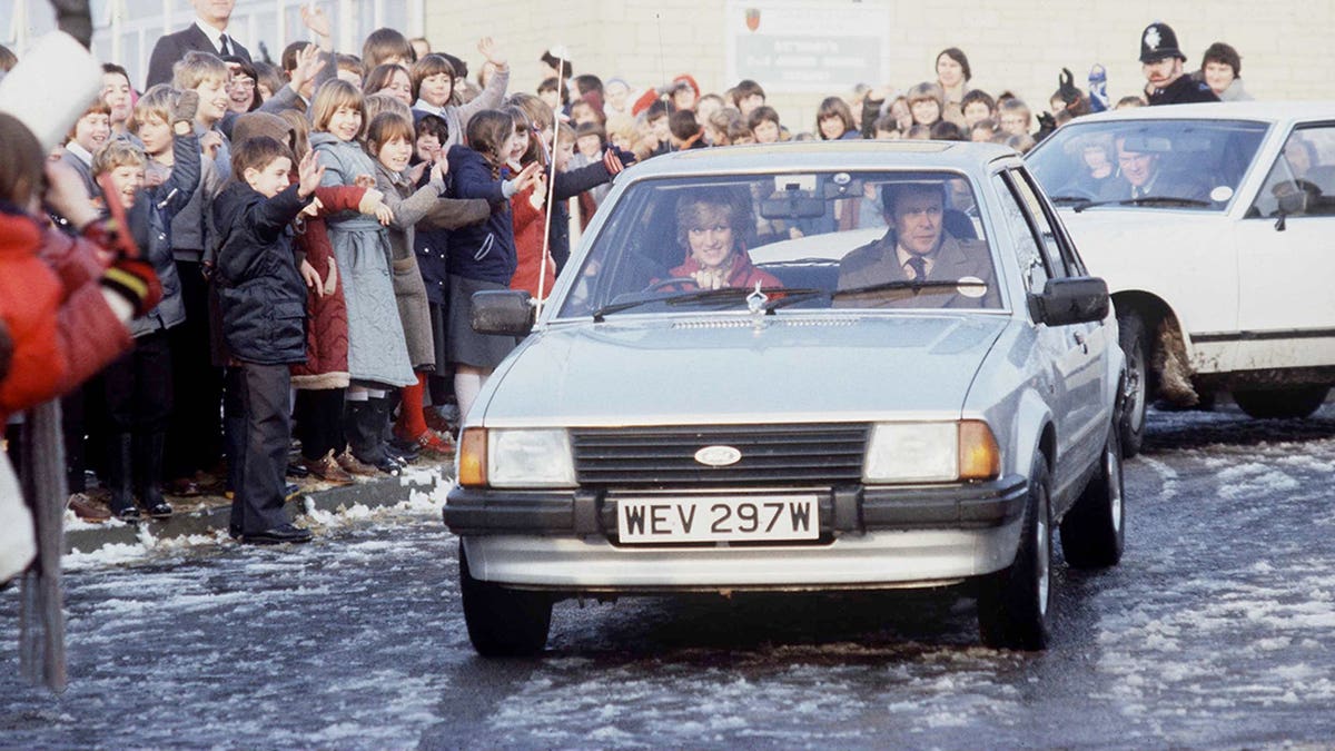 Diana Driving her car to a school visit with police bodyguard Graham Smith.