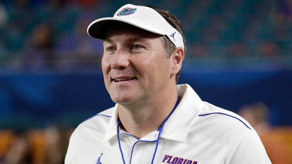 FILE - Florida head coach Dan Mullen walks on the field before the Orange Bowl NCAA college football game against Virginia in Miami Gardens, Fla., in this Monday, Dec. 30, 2019, file photo. 