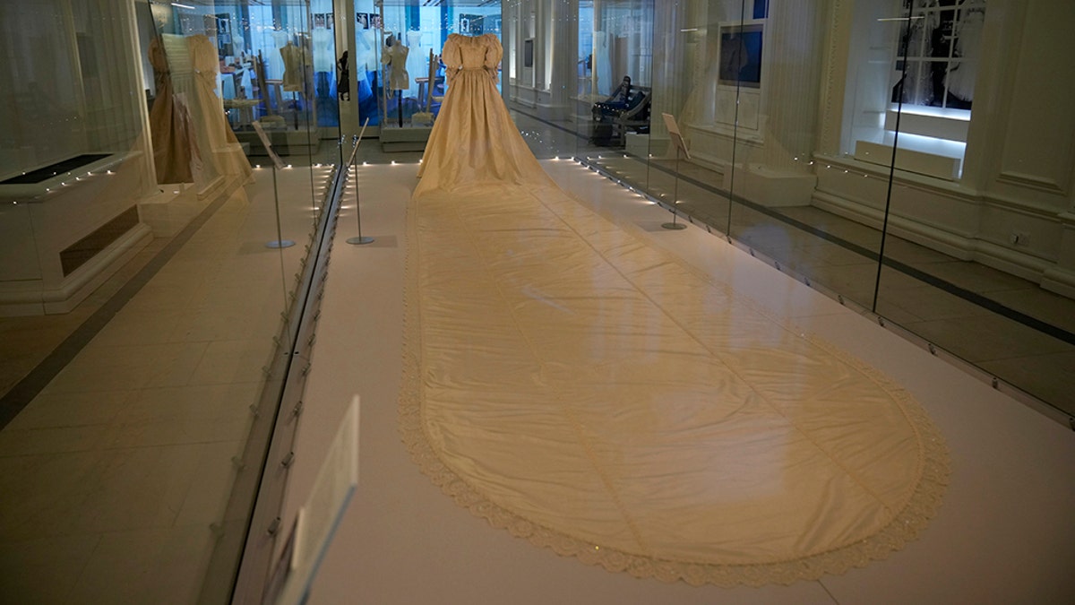 Princess Diana's taffeta-ruffled white dress has a 25-foot sequin-encrusted train. The iconic dress was designed by David and Elizabeth Emanuel. (AP Photo/Matt Dunham)