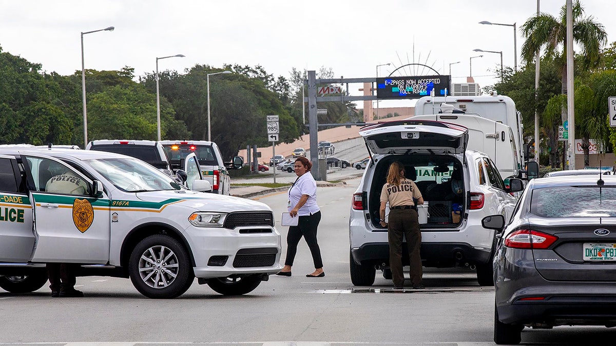 Police block an intersection near the Miami-Dade Kendall Campus in Miami, Fla., on Sunday, June 6, 2021. (Daniel A Varela/Miami Herald via AP)