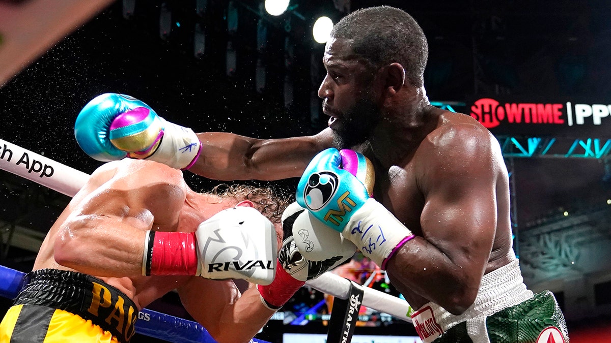Floyd Mayweather, right, and Logan Paul fight during an exhibition boxing match at Hard Rock Stadium, Sunday, June 6, 2021, in Miami Gardens, Fla.