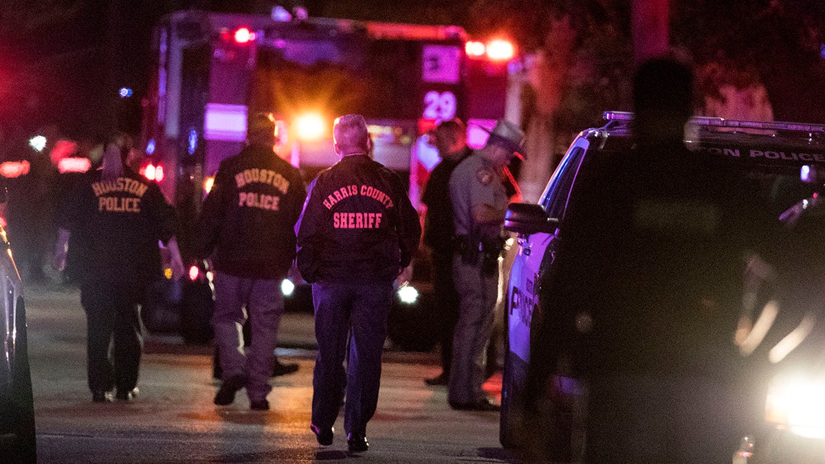 In this Monday, Jan. 28, 2019, file photo, police investigate the scene where several Houston Police officers were shot in Houston.  (Brett Coomer/Houston Chronicle via AP, File)